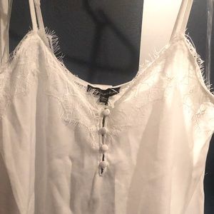 White tank top. Super cute fringe design with detailed buttons. Sz L with tags